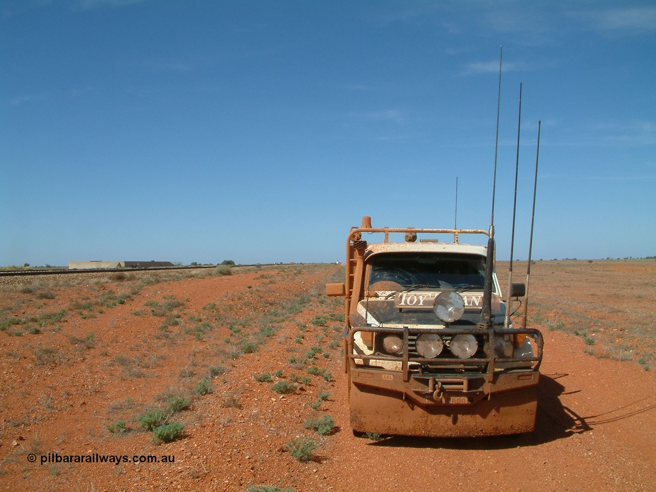 030416 110330
Here we are at a siding on the Tarcoola - Alice Springs railway line, Manguri which is 200 km north of Tarcoola and 40 km from Coober Pedy, loading platform on the left. As you can see the track was a bit wet. 16th April 2003. [url=https://goo.gl/maps/y8coKnvDBraSuT8G7]GeoData location[/url]. 16th April 2003.
