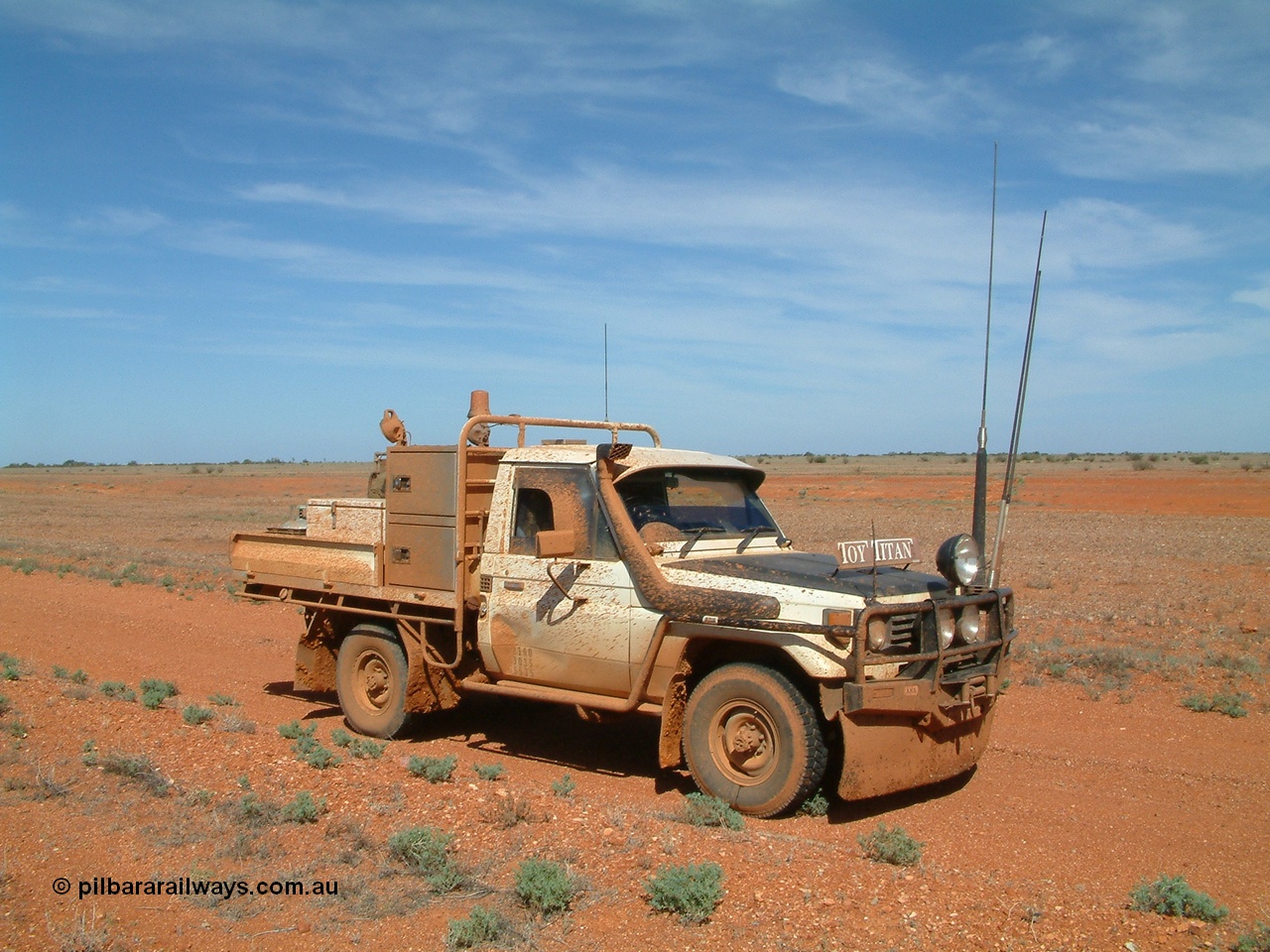 030416 110340
Here we are at a siding on the Tarcoola - Alice Springs railway line, Manguri which is 200 km north of Tarcoola and 40 km from Coober Pedy. As you can see the track was a bit wet. 16th April 2003. [url=https://goo.gl/maps/y8coKnvDBraSuT8G7]GeoData location[/url]. 16th April 2003.
