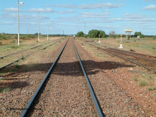 030415 154424
Tarcoola, at the 504.5 km, looking east along the Trans Australian Railway in the middle of the yard, the Central Australian Railway is on the left, loop on the right, east leg of triangle is just in view with the sidings running east behind the large tree and water tank. Tarcoola is the junction for the TAR and CAR railways situated 504 km from the 0 km datum at Coonamia. [url=https://goo.gl/maps/cWayk3LD2QQjX6Z88]GeoData location[/url]. 15th April 2003.

