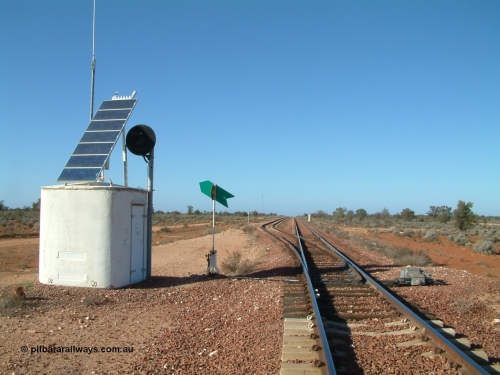 030416 084506
Carnes Siding located at the 566.4 km on the Central Australian line from Tarcoola to Alice Springs. Looking south from the north end of the loop, interlocking hut with repeater searchlight signal, point indicator and dual control point machine, in the distance the north end train control 'pillbox' can be seen. [url=https://goo.gl/maps/UV5pRwSrTaW3bxA76]GeoData location[/url]. 1April 6, 2003.
