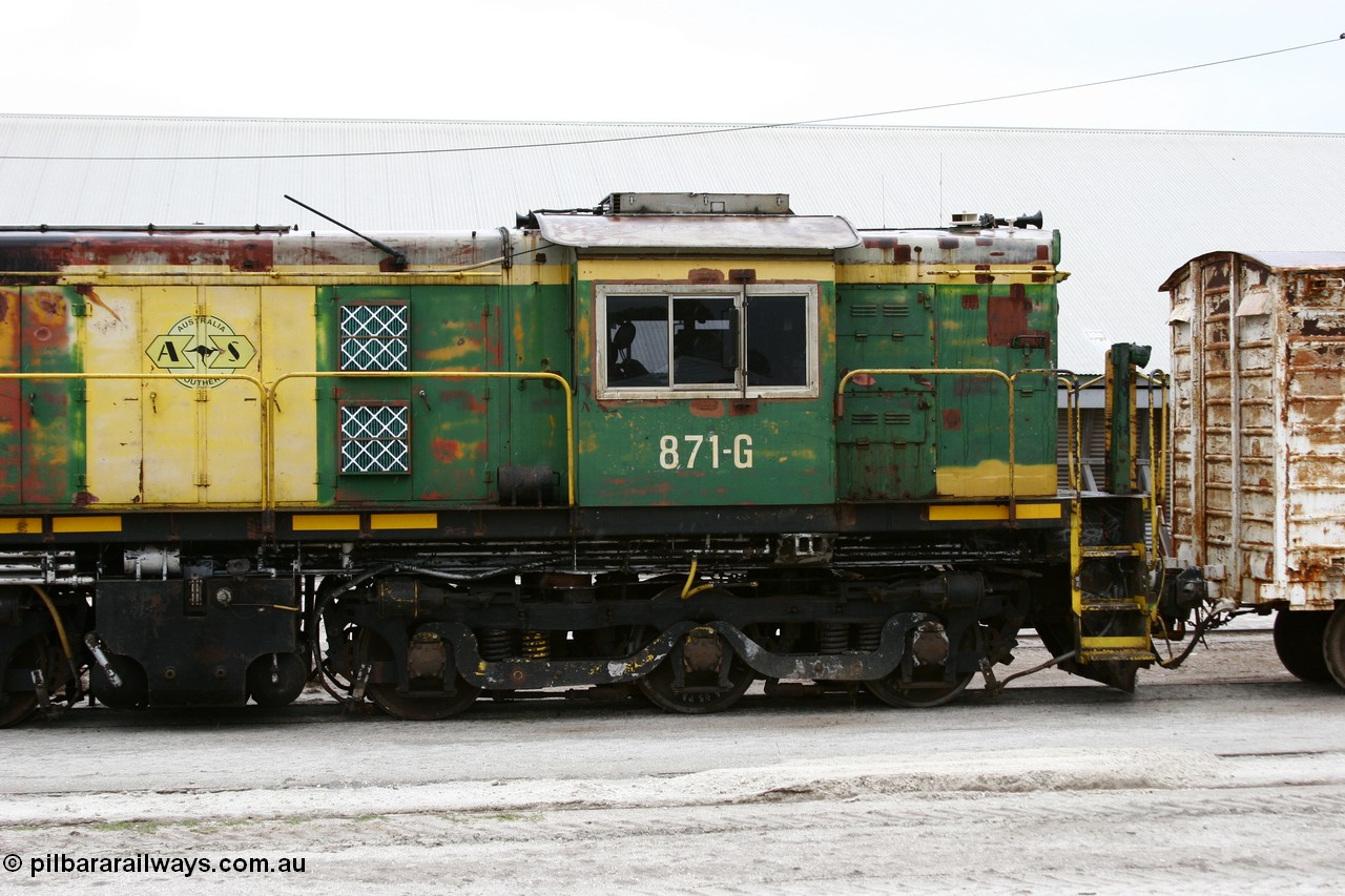 051102 6612
Thevenard, cab side of AE Goodwin ALCo model DL531 830 class locomotive 871 serial G3422-1, issued when built in 1966 to the Eyre Peninsula division of South Australian Railways. Still wearing Australian National green and yellow but with ASR decals as it stands in the yard coupled to an ENBA type louvre van.
Keywords: 830-class;871;G3422-1;AE-Goodwin;ALCo;DL531;