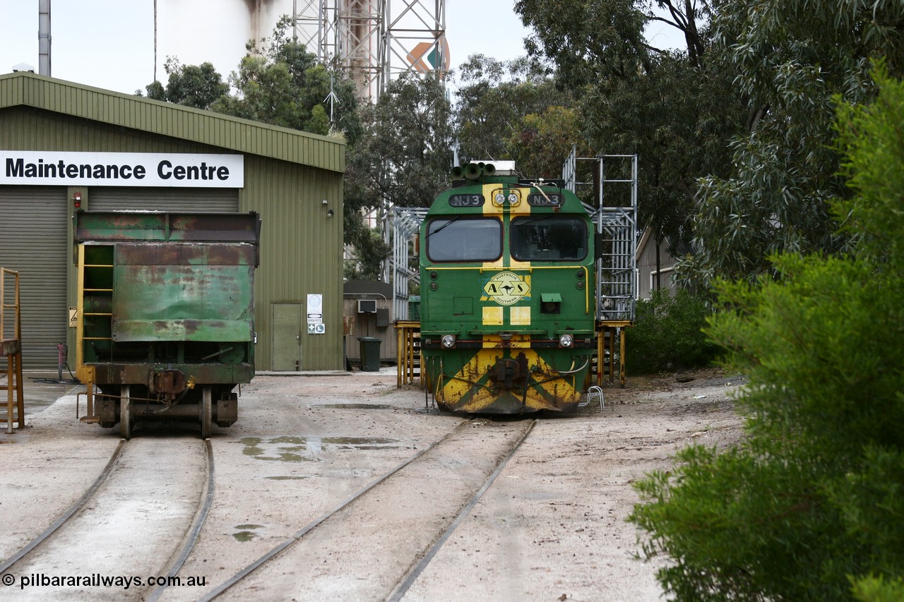 051102 6613
Thevenard Maintenance Centre has NJ class Clyde Engineering EMD JL22C model unit NJ 3 serial 71-730, built in 1971 at Clyde's Granville NSW workshops, started out on the Central Australia Railway for the Commonwealth Railways before being transferred to the Eyre Peninsula system in 1981. Still in AN green but lettered for Australian Southern Railroad and a lone ENH type hopper standing around 'on-shed'.
Keywords: NJ-class;NJ3;71-730;Clyde-Engineering-Granville-NSW;EMD;JL22C;