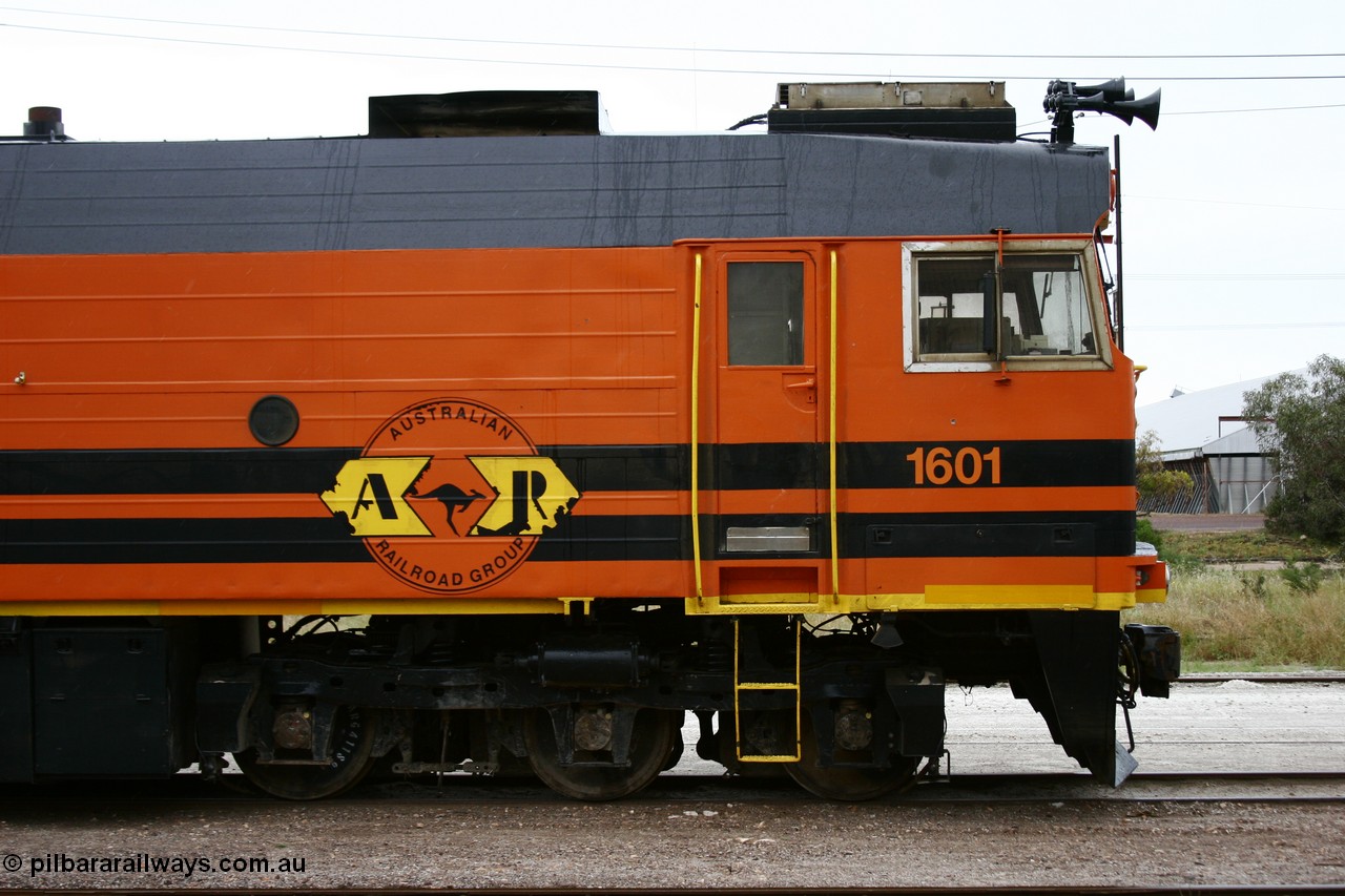 051102 6617
Thevenard, right hand cab side of Clyde Engineering EMD JL22C model unit and class leader 1601, originally NJ 1 serial 71-728, built in 1971 at Clyde's Granville NSW workshops, started out on the Central Australia Railway for the Commonwealth Railways before being transferred to the Eyre Peninsula system in 1981, repainted and renumbered to 1601 in November 2004.
Keywords: 1600-class;1601;Clyde-Engineering-Granville-NSW;EMD;JL22C;71-728;NJ-class;NJ1;