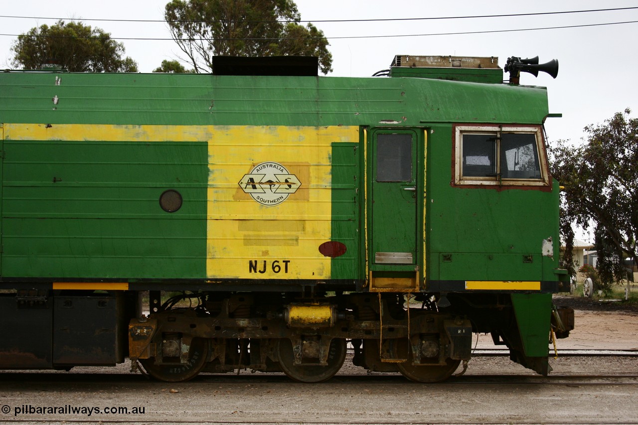 051102 6627
Thevenard, cab side view of NJ class Clyde Engineering EMD JL22C model unit NJ 6 serial 71-733, built in 1971 at Clyde's Granville NSW workshops, started out on the Central Australia Railway for the Commonwealth Railways before being transferred to the Eyre Peninsula system in 1981. Still in AN green but lettered for Australian Southern Railroad. 
Keywords: NJ-class;NJ6;71-733;Clyde-Engineering-Granville-NSW;EMD;JL22C;