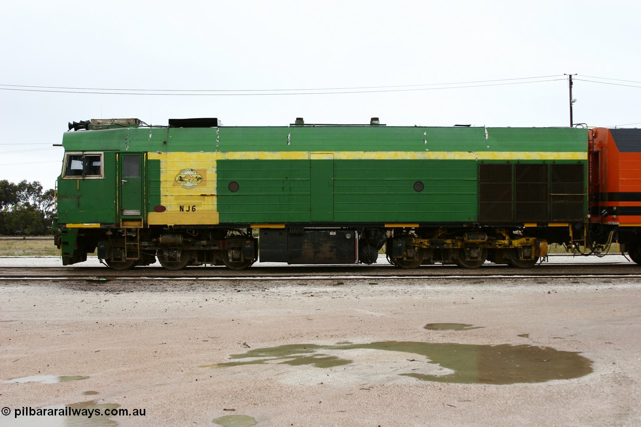 051102 6631
Thevenard, left hand side view of NJ class Clyde Engineering EMD JL22C model unit NJ 6 serial 71-733, built in 1971 at Clyde's Granville NSW workshops, started out on the Central Australia Railway for the Commonwealth Railways before being transferred to the Eyre Peninsula system in 1981. Still in AN green but lettered for Australian Southern Railroad. 
Keywords: NJ-class;NJ6;Clyde-Engineering-Granville-NSW;EMD;JL22C;71-733;