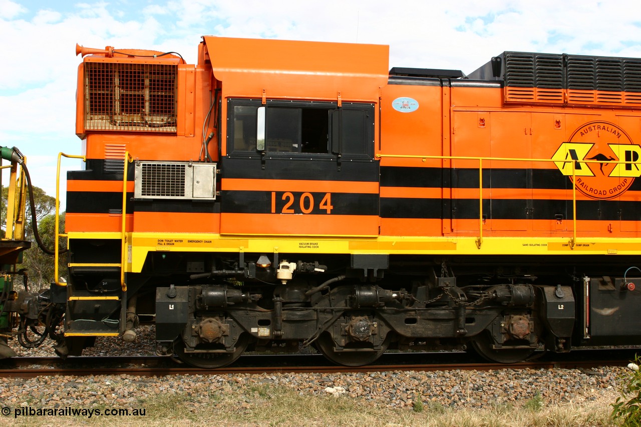 060108 2056
Lock, ARG 1200 class unit 1204, a Clyde Engineering EMD model G12C serial 65-428, final of fourteen originally built between 1960-65 for WAGR as their A class A 1514, fitted with dynamic brakes and financed by Western Mining Corporation, started on the Eyre Peninsula in August 2004.
Keywords: 1200-class;1204;Clyde-Engineering-Granville-NSW;EMD;G12C;65-428;A-class;A1514;