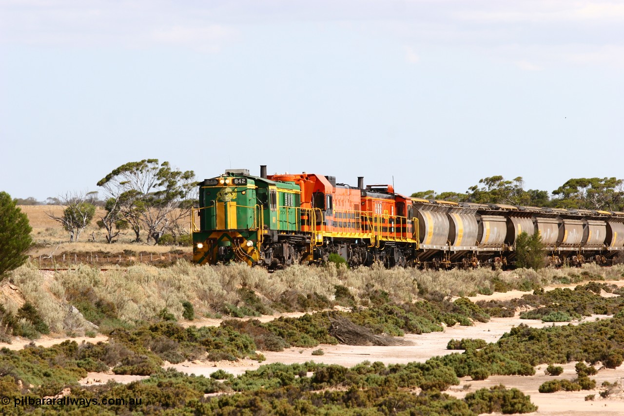 060109 2092
Kyancutta at the 198 km, ASR 830 class unit 842, an AE Goodwin built ALCo DL531 model loco serial 84140 leads EMD unit 1204 due to air-conditioning trouble and sister ALCo 851 across a dry salt soak with a north bound empty grain train. 9th January 2006.
Keywords: 830-class;842;AE-Goodwin;ALCo;DL531;84140;