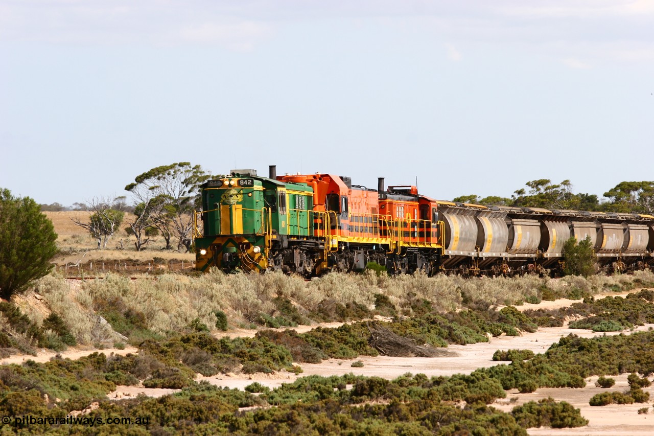 060109 2093
Kyancutta at the 198 km, ASR 830 class unit 842, an AE Goodwin built ALCo DL531 model loco serial 84140 leads EMD unit 1204 due to air-conditioning trouble and sister ALCo 851 across a dry salt soak with a north bound empty grain train. 9th January 2006.
Keywords: 830-class;842;AE-Goodwin;ALCo;DL531;84140;