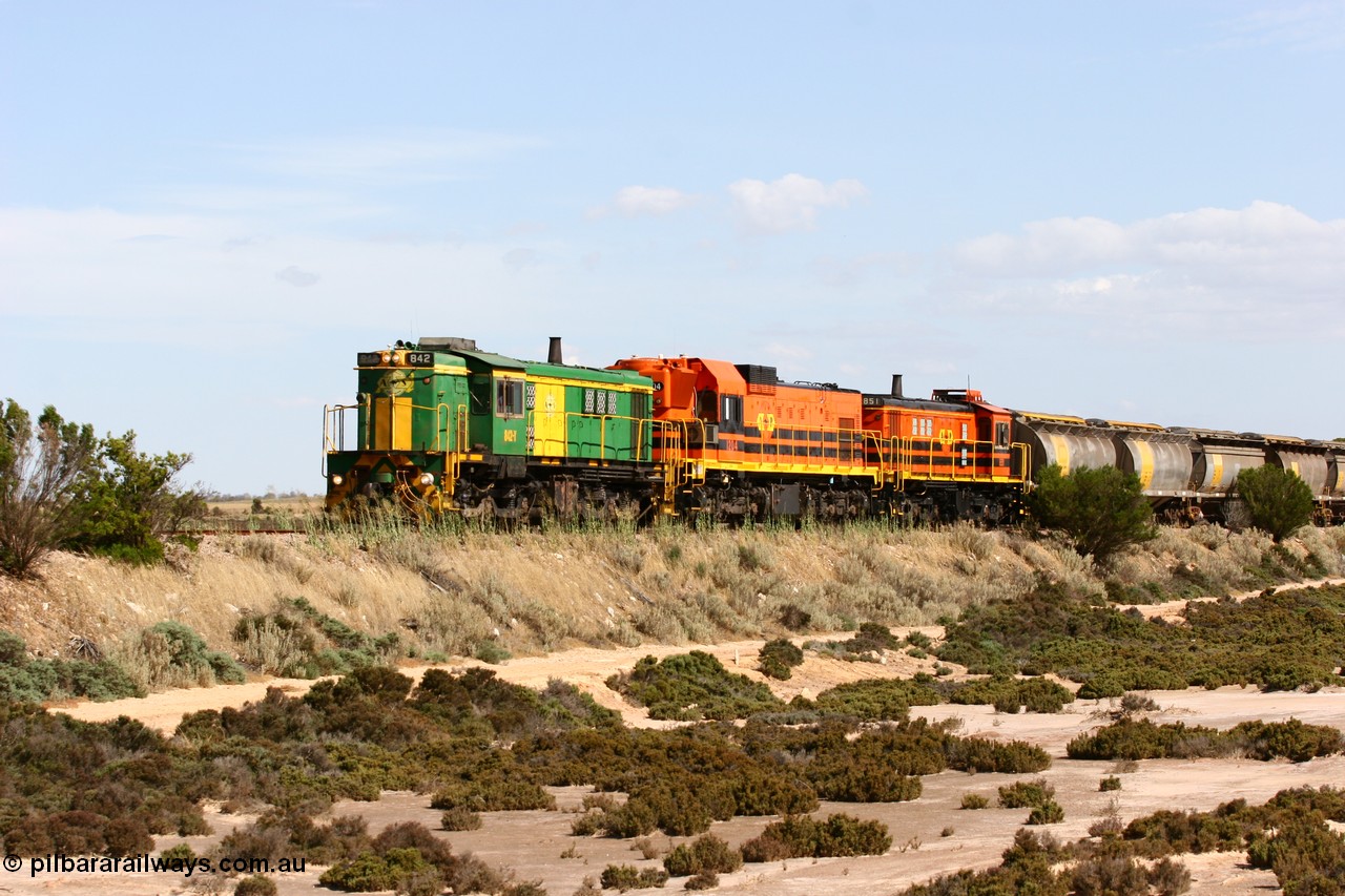 060109 2096
Kyancutta at the 198 km, ASR 830 class unit 842, an AE Goodwin built ALCo DL531 model loco serial 84140 leads EMD unit 1204 due to air-conditioning trouble and sister ALCo 851 across a dry salt soak with a north bound empty grain train. 9th January 2006.
Keywords: 830-class;842;84140;AE-Goodwin;ALCo;DL531;