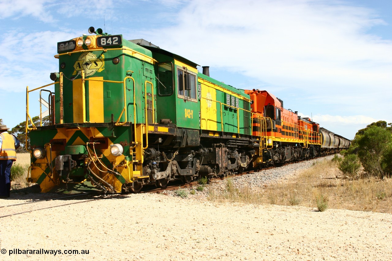 060109 2103
Kyancutta, Kyancutta Tanks Rd grade crossing, ASR 830 class unit 842, an AE Goodwin built ALCo DL531 model loco serial 84140 leads EMD unit 1204 due to air-conditioning trouble and sister ALCo 851 as the empty north bound grain train pauses for a crew change. 9th January 2006.
Keywords: 830-class;842;84140;AE-Goodwin;ALCo;DL531;