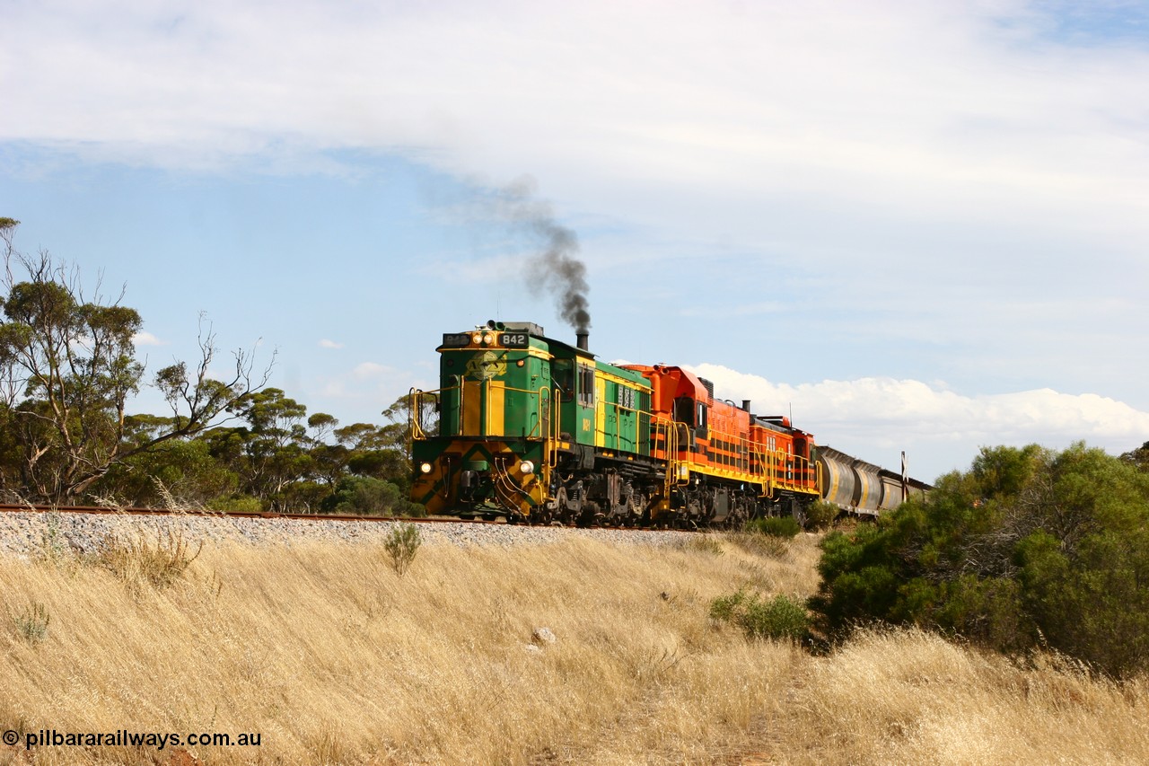 060109 2105
Kyancutta, Kyancutta Tanks Rd grade crossing, ASR 830 class unit 842, an AE Goodwin built ALCo DL531 model loco serial 84140 leads EMD unit 1204 due to air-conditioning trouble and sister ALCo 851 lift the empty north bound grain train away from crew change. 9th January 2006.
Keywords: 830-class;842;84140;AE-Goodwin;ALCo;DL531;