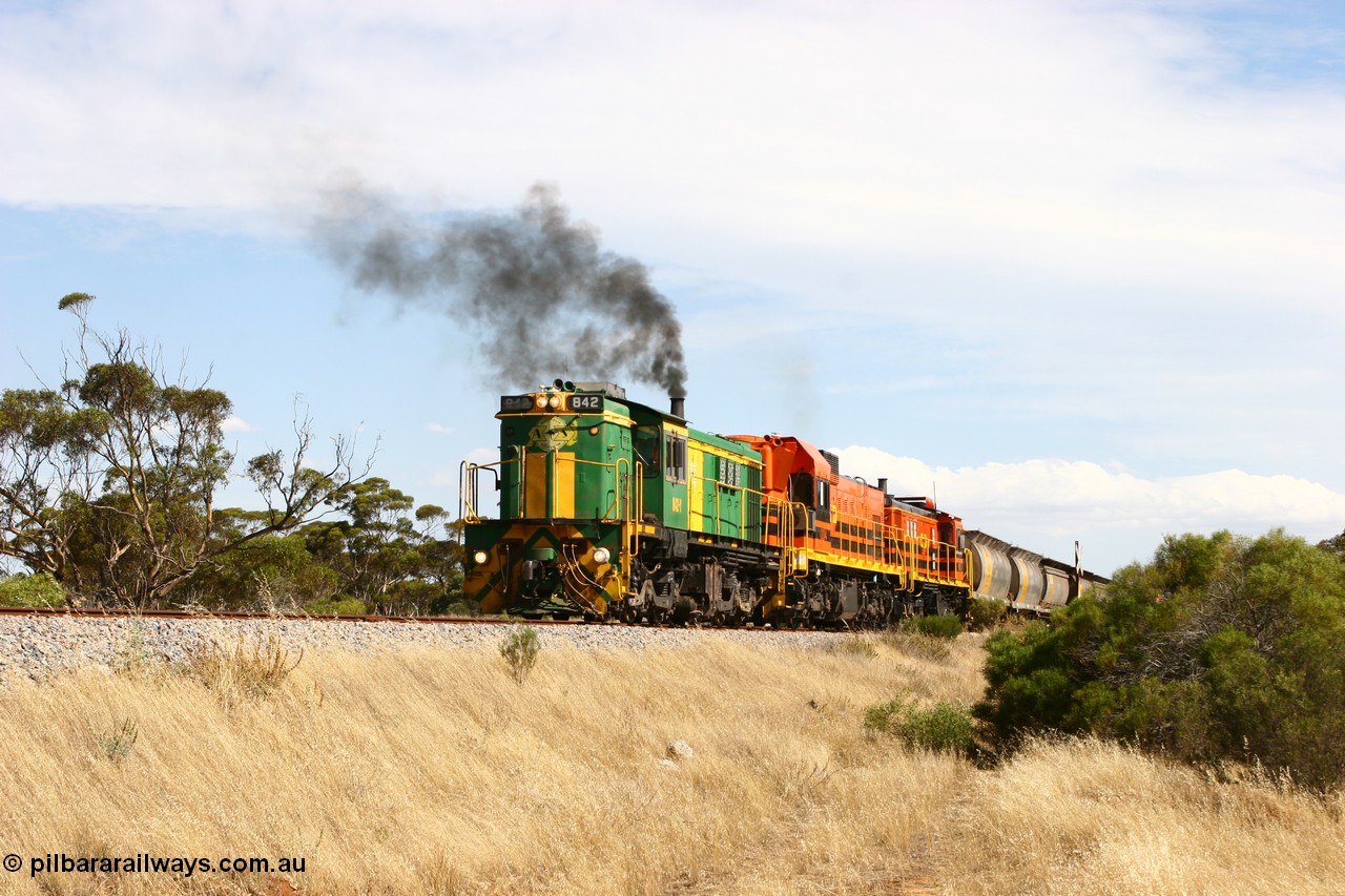 060109 2106
Kyancutta, Kyancutta Tanks Rd grade crossing, ASR 830 class unit 842, an AE Goodwin built ALCo DL531 model loco serial 84140 leads EMD unit 1204 due to air-conditioning trouble and sister ALCo 851 lift the empty north bound grain train away from crew change. 9th January 2006.
Keywords: 830-class;842;AE-Goodwin;ALCo;DL531;84140;