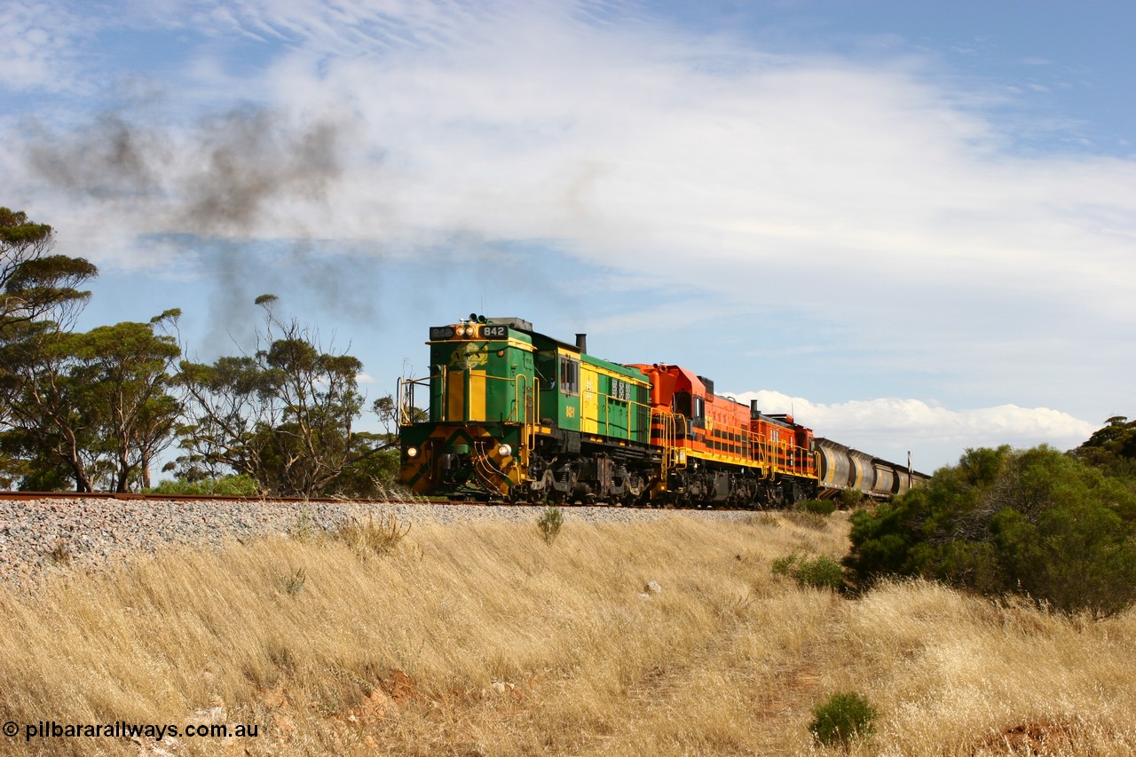 060109 2107
Kyancutta, Kyancutta Tanks Rd grade crossing, ASR 830 class unit 842, an AE Goodwin built ALCo DL531 model loco serial 84140 leads EMD unit 1204 due to air-conditioning trouble and sister ALCo 851 lift the empty north bound grain train away from crew change. 9th January 2006.
Keywords: 830-class;842;84140;AE-Goodwin;ALCo;DL531;