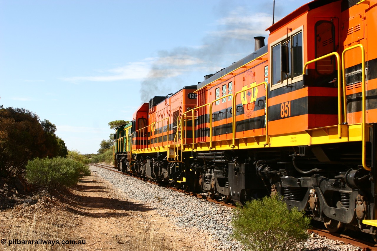 060109 2109
Kyancutta, Kyancutta Tanks Rd grade crossing, ASR 830 class unit 842, an AE Goodwin built ALCo DL531 model loco serial 84140 leads EMD unit 1204 due to air-conditioning trouble and sister ALCo 851 lift the empty north bound grain train away from crew change. 9th January 2006.
