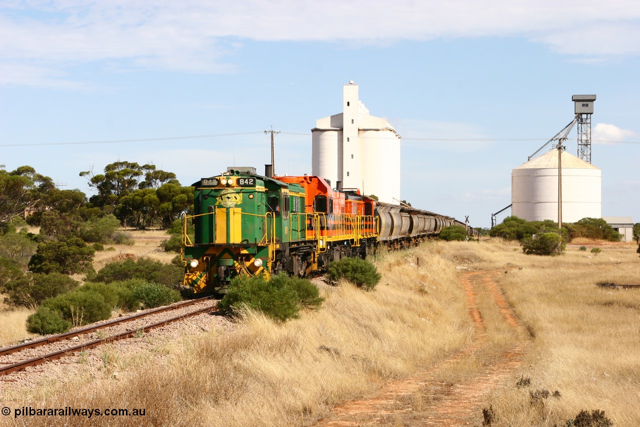 060109 2113
Kyancutta, ASR 830 class unit 842, an AE Goodwin built ALCo DL531 model loco serial 84140 leads EMD unit 1204 due to air-conditioning trouble and sister ALCo 851 as they shunt across Museum Terrace to place empty grain waggons on the silo loop. 9th January 2006.
Keywords: 830-class;842;AE-Goodwin;ALCo;DL531;84140;