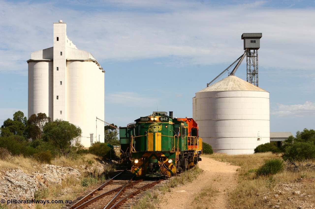 060109 2121
Kyancutta, ASR 830 class unit 842, an AE Goodwin built ALCo DL531 model loco serial 84140 leads EMD unit 1204 due to air-conditioning trouble and sister ALCo 851 as they shunt empty grain waggons on the silo loop. 9th January 2006.
Keywords: 830-class;842;84140;AE-Goodwin;ALCo;DL531;