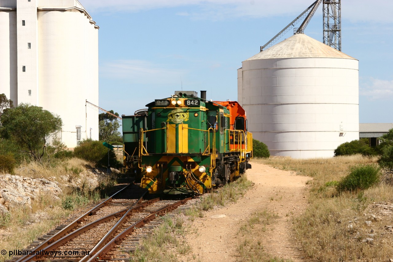 060109 2122
Kyancutta, ASR 830 class unit 842, an AE Goodwin built ALCo DL531 model loco serial 84140 leads EMD unit 1204 due to air-conditioning trouble and sister ALCo 851 as they shunt empty grain waggons on the silo loop. 9th January 2006.
Keywords: 830-class;842;84140;AE-Goodwin;ALCo;DL531;