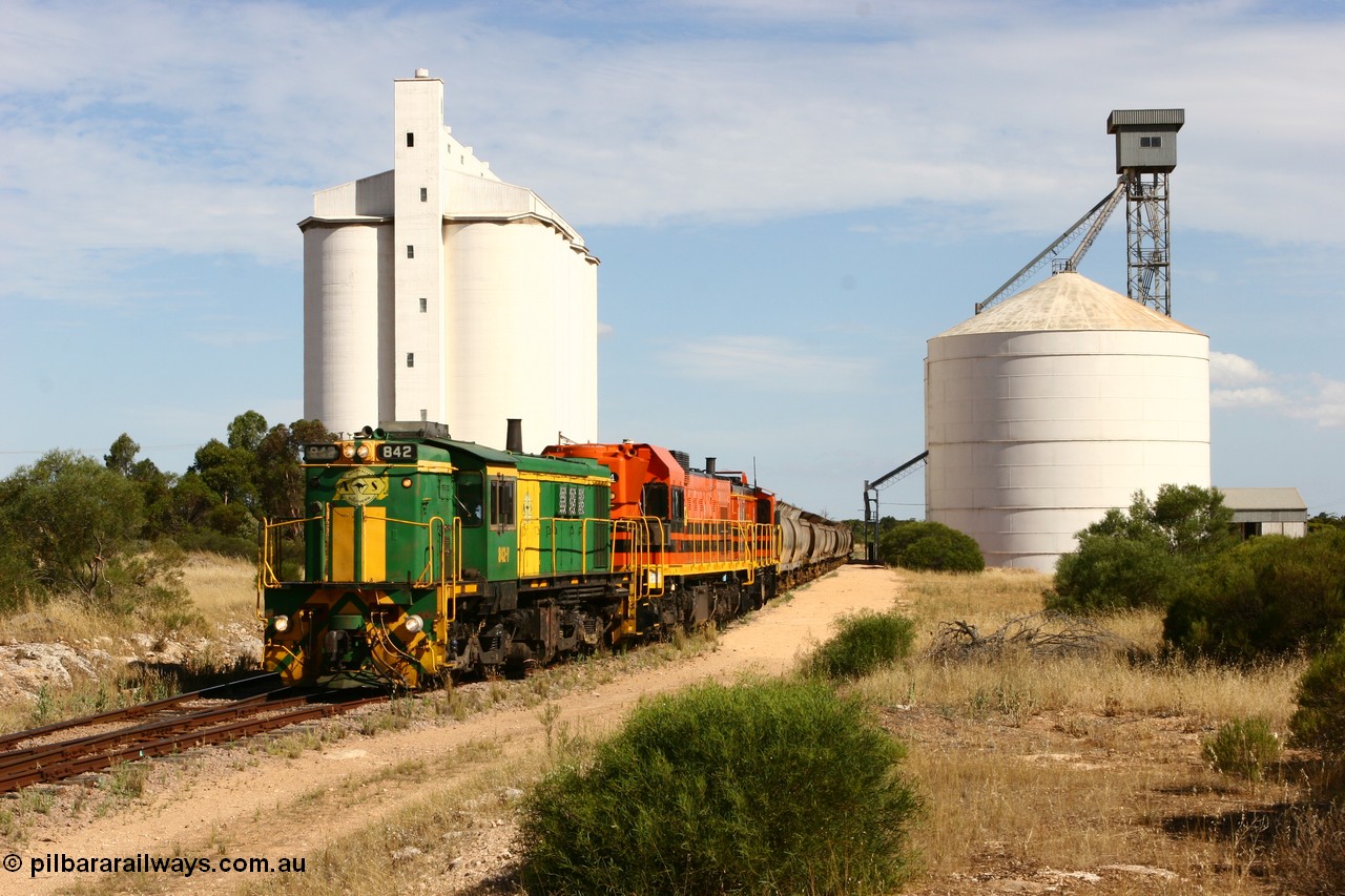 060109 2123
Kyancutta, ASR 830 class unit 842, an AE Goodwin built ALCo DL531 model loco serial 84140 leads EMD unit 1204 due to air-conditioning trouble and sister ALCo 851 as they shunt empty grain waggons on the silo loop. 9th January 2006.
Keywords: 830-class;842;84140;AE-Goodwin;ALCo;DL531;