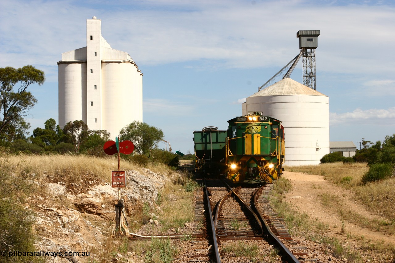 060109 2125
Kyancutta, ASR 830 class unit 842, an AE Goodwin built ALCo DL531 model loco serial 84140 leads EMD unit 1204 due to air-conditioning trouble and sister ALCo 851 as they shunt empty grain waggons on the silo loop. 9th January 2006.
Keywords: 830-class;842;AE-Goodwin;ALCo;DL531;84140;