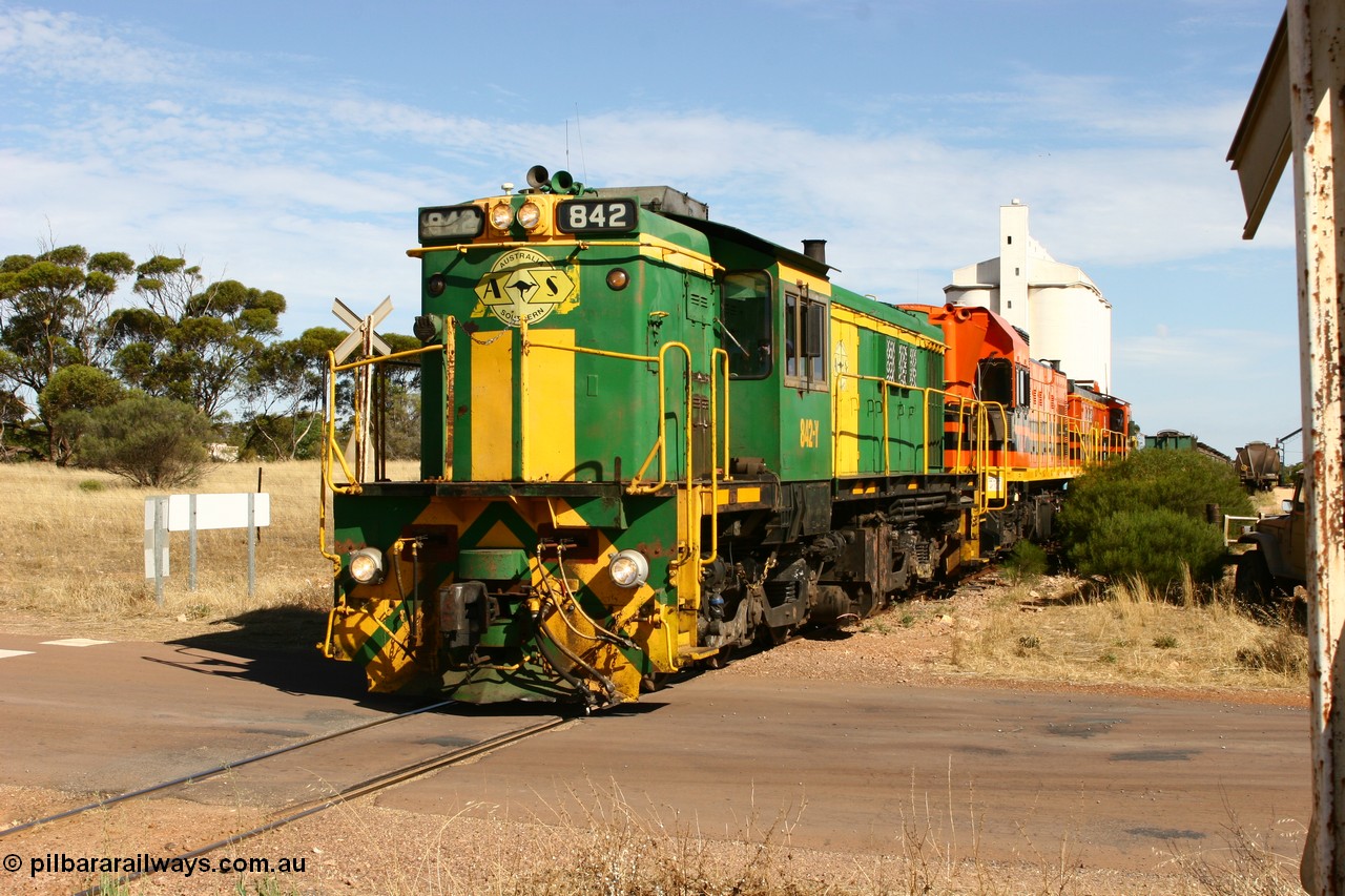 060109 2128
Kyancutta, ASR 830 class unit 842, an AE Goodwin built ALCo DL531 model loco serial 84140 leads EMD unit 1204 due to air-conditioning trouble and sister ALCo 851 as they shunt across Museum Terrace to re-join the train on the mainline. 9th January 2006.
Keywords: 830-class;842;84140;AE-Goodwin;ALCo;DL531;