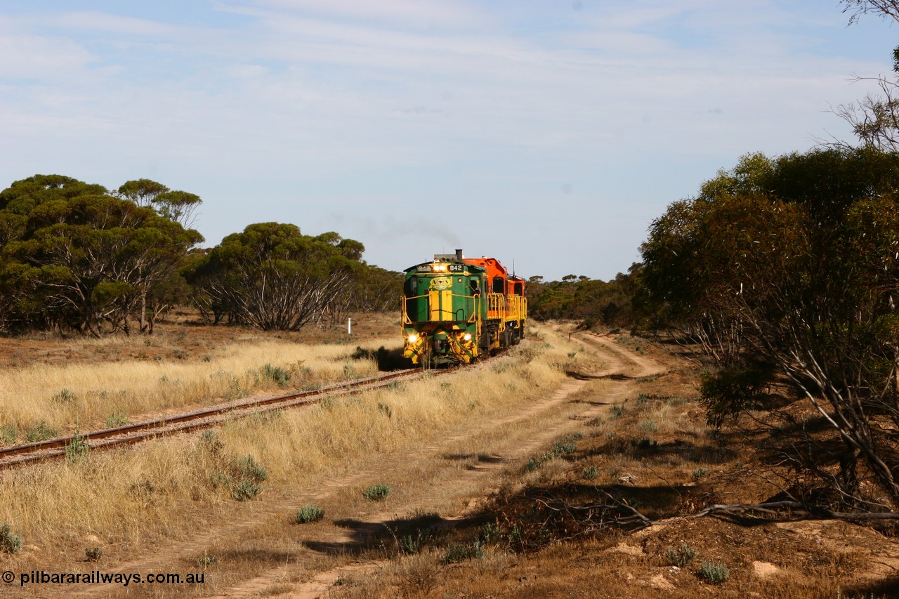 060109 2137
Wannamana, [url=https://goo.gl/maps/43EOs]on the curve[/url] 2 km north of the former station site empty train lead by ASR 830 class unit 842, an AE Goodwin built ALCo DL531 model loco serial 84140 with an EMD 1200 class and a sister ALCo unit. 9th January 2006.
Keywords: 830-class;842;84140;AE-Goodwin;ALCo;DL531;
