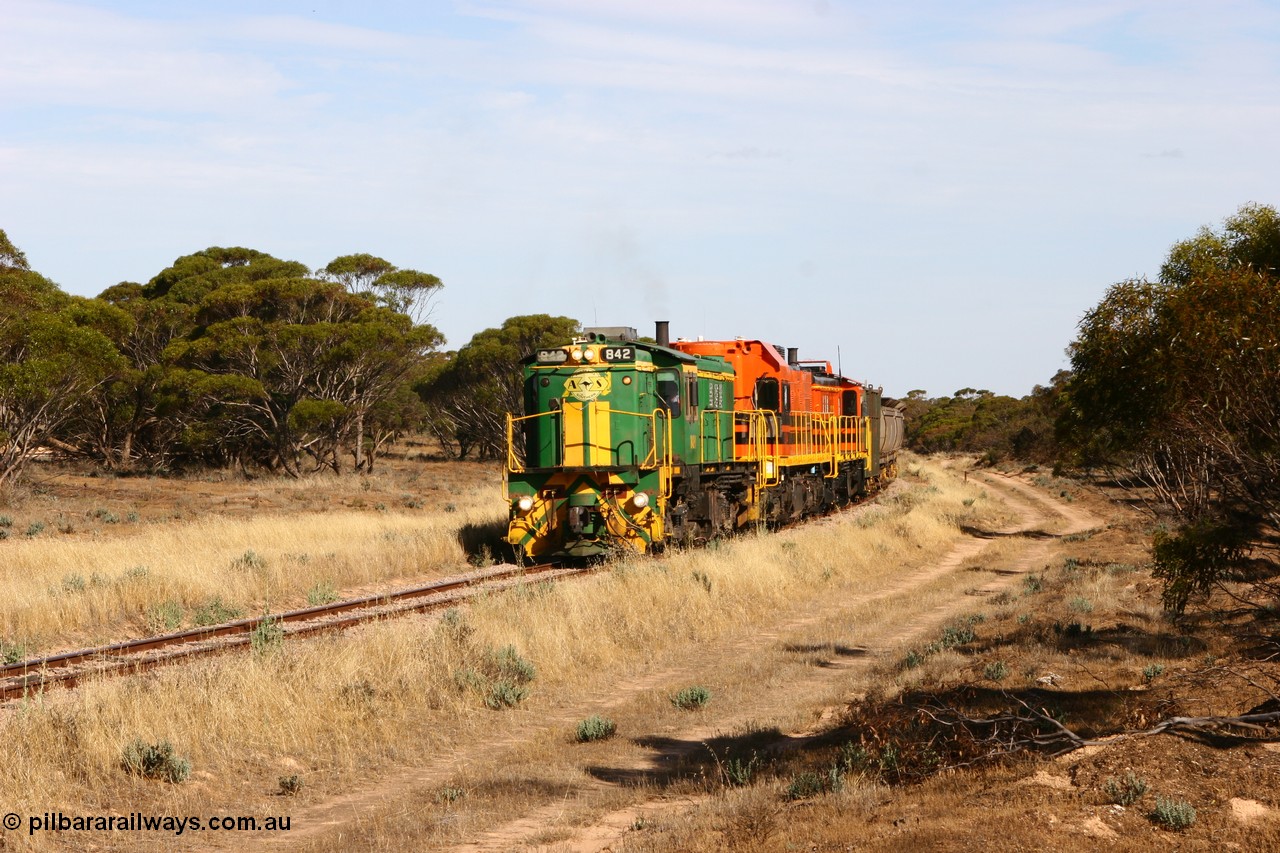 060109 2138
Wannamana, [url=https://goo.gl/maps/43EOs]on the curve[/url] 2 km north of the former station site empty train lead by ASR 830 class unit 842, an AE Goodwin built ALCo DL531 model loco serial 84140 with an EMD 1200 class and a sister ALCo unit. 9th January 2006.
Keywords: 830-class;842;AE-Goodwin;ALCo;DL531;84140;