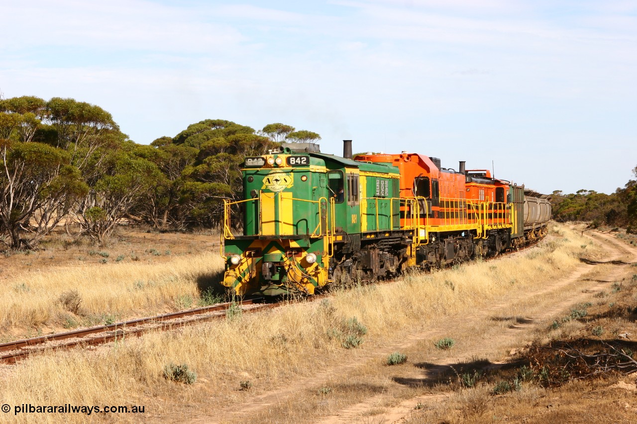 060109 2139
Wannamana, [url=https://goo.gl/maps/43EOs]on the curve[/url] 2 km north of the former station site empty train lead by ASR 830 class unit 842, an AE Goodwin built ALCo DL531 model loco serial 84140 with an EMD 1200 class and a sister ALCo unit. 9th January 2006.
Keywords: 830-class;842;84140;AE-Goodwin;ALCo;DL531;