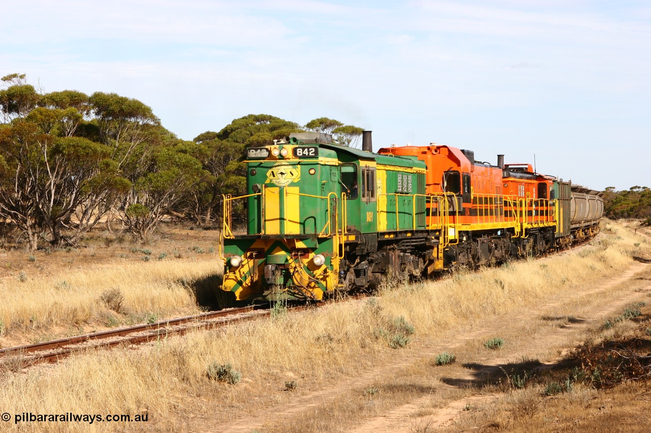 060109 2140
Wannamana, [url=https://goo.gl/maps/43EOs]on the curve[/url] 2 km north of the former station site empty train lead by ASR 830 class unit 842, an AE Goodwin built ALCo DL531 model loco serial 84140 with an EMD 1200 class and a sister ALCo unit. 9th January 2006.
Keywords: 830-class;842;84140;AE-Goodwin;ALCo;DL531;