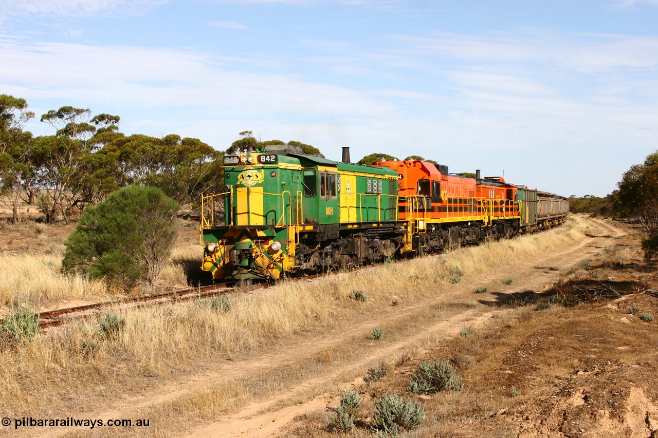 060109 2141
Wannamana, [url=https://goo.gl/maps/43EOs]on the curve[/url] 2 km north of the former station site empty train lead by ASR 830 class unit 842, an AE Goodwin built ALCo DL531 model loco serial 84140 with an EMD 1200 class and a sister ALCo unit. 9th January 2006.
Keywords: 830-class;842;84140;AE-Goodwin;ALCo;DL531;