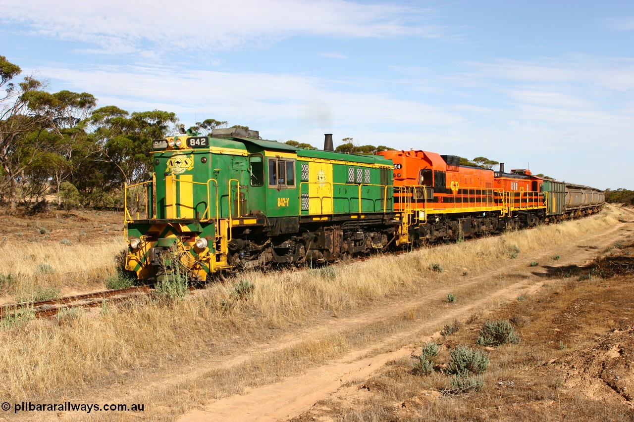 060109 2143
Wannamana, [url=https://goo.gl/maps/43EOs]on the curve[/url] 2 km north of the former station site empty train lead by ASR 830 class unit 842, an AE Goodwin built ALCo DL531 model loco serial 84140 with an EMD 1200 class and a sister ALCo unit. 9th January 2006.
Keywords: 830-class;842;AE-Goodwin;ALCo;DL531;84140;