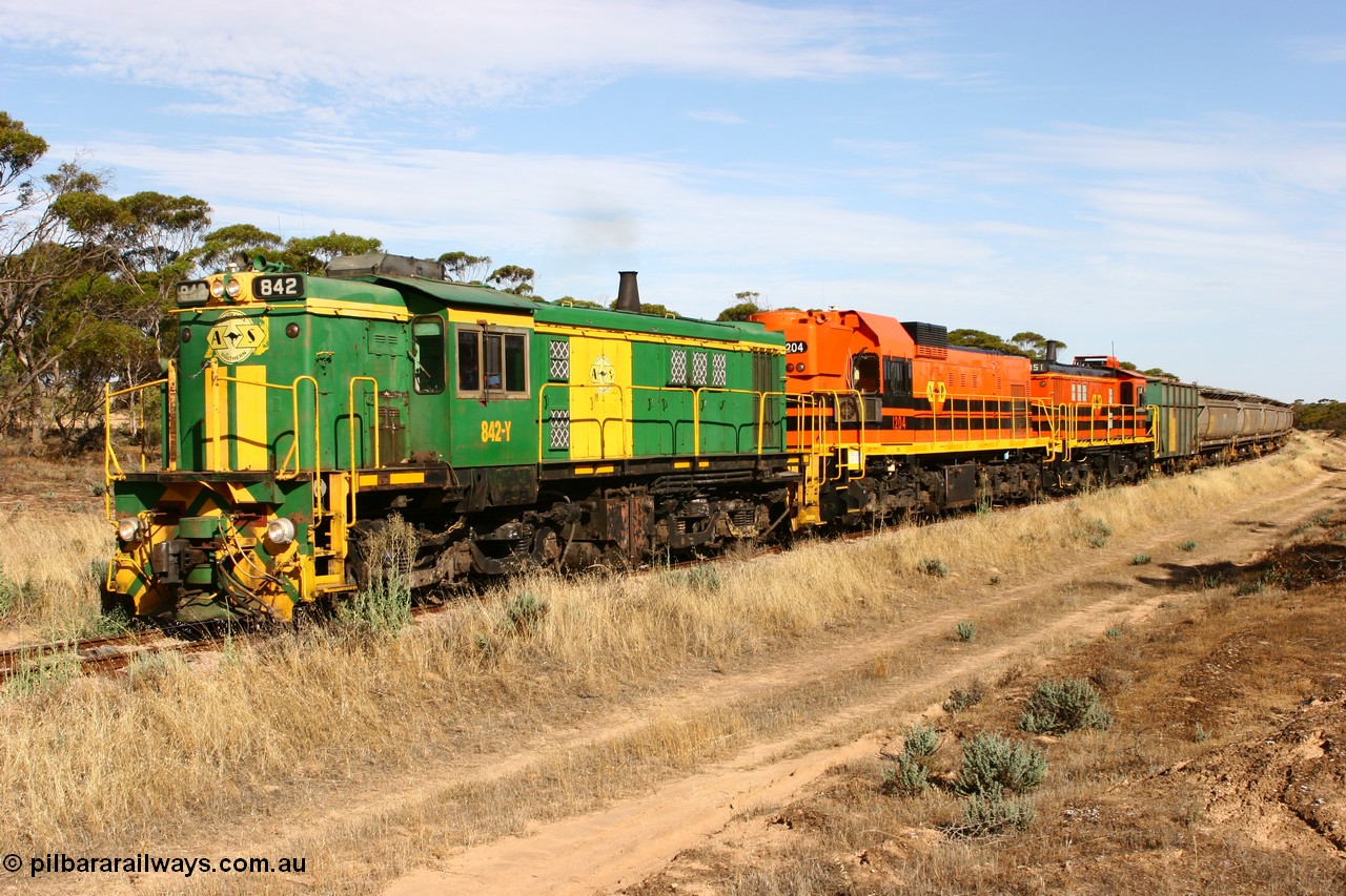 060109 2144
Wannamana, [url=https://goo.gl/maps/43EOs]on the curve[/url] 2 km north of the former station site empty train lead by ASR 830 class unit 842, an AE Goodwin built ALCo DL531 model loco serial 84140 with an EMD 1200 class and a sister ALCo unit. 9th January 2006.
Keywords: 830-class;842;84140;AE-Goodwin;ALCo;DL531;