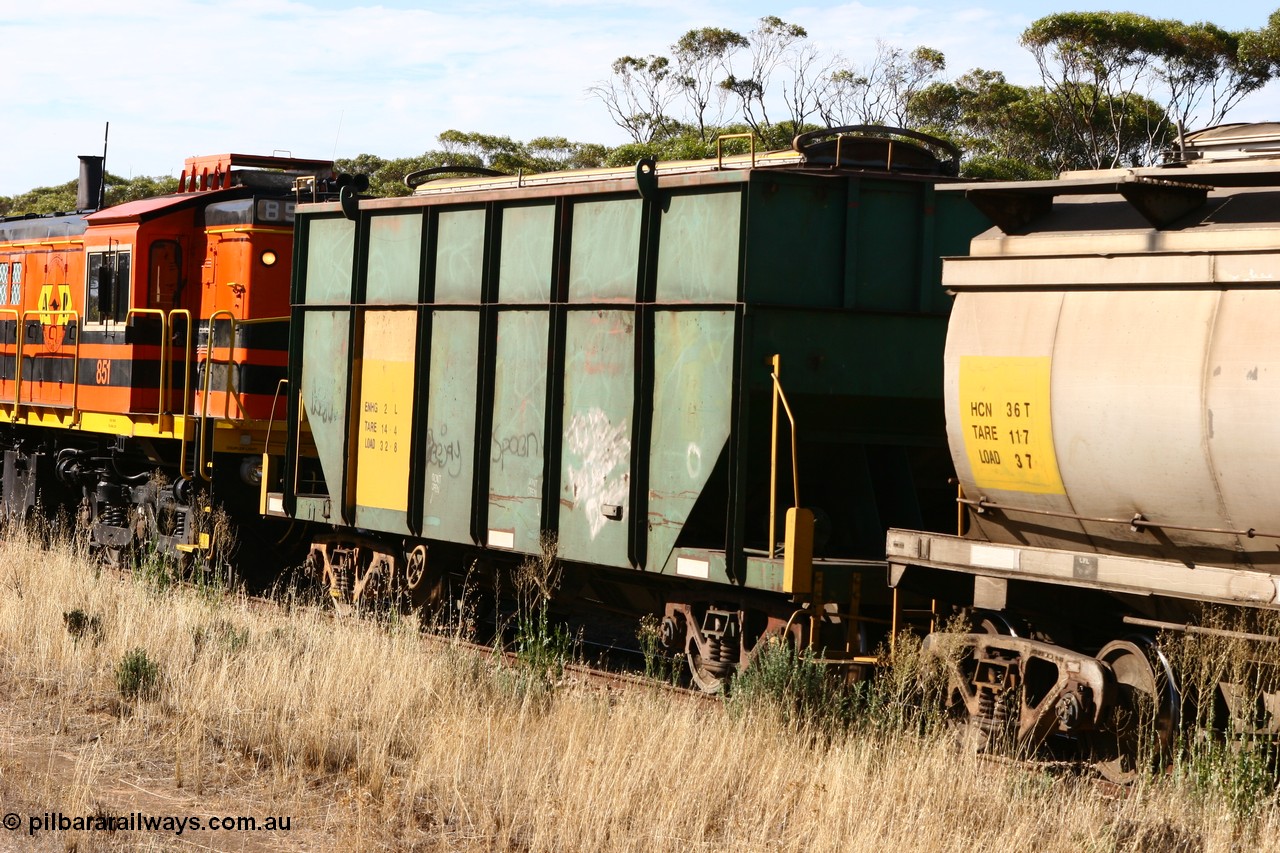 060109 2146
Wannamana, trailing view of former Australian National narrow gauge ENHG type bogie grain waggon ENHG 2, originally built by Moore Road Ind, Victoria as NB type NB 1395 ballast hopper for the NAR, then to standard gauge in 1975 as BA type BA 1539, recoded to AHTY in 1980, to EP April 1984, recoded to NHG type NHG 5 in May 1984, then again to ENHT type ENHT 5 in March 1985 and further rebuilt forming one half of ENHG type grain waggon in August 1986. The conversion involved splicing two AHTY-ENHT type waggons together at Port Lincoln workshops, part of an empty train [url=https://goo.gl/maps/43EOs]on the curve[/url]. 9th January 2006.
Keywords: ENHG-type;ENHG2;Moore-Road-Ind-Victoria;NB-type;NB1395;BA-type;BA1539;AHTY-type;NHG-type;NHG5;ENHT-type;