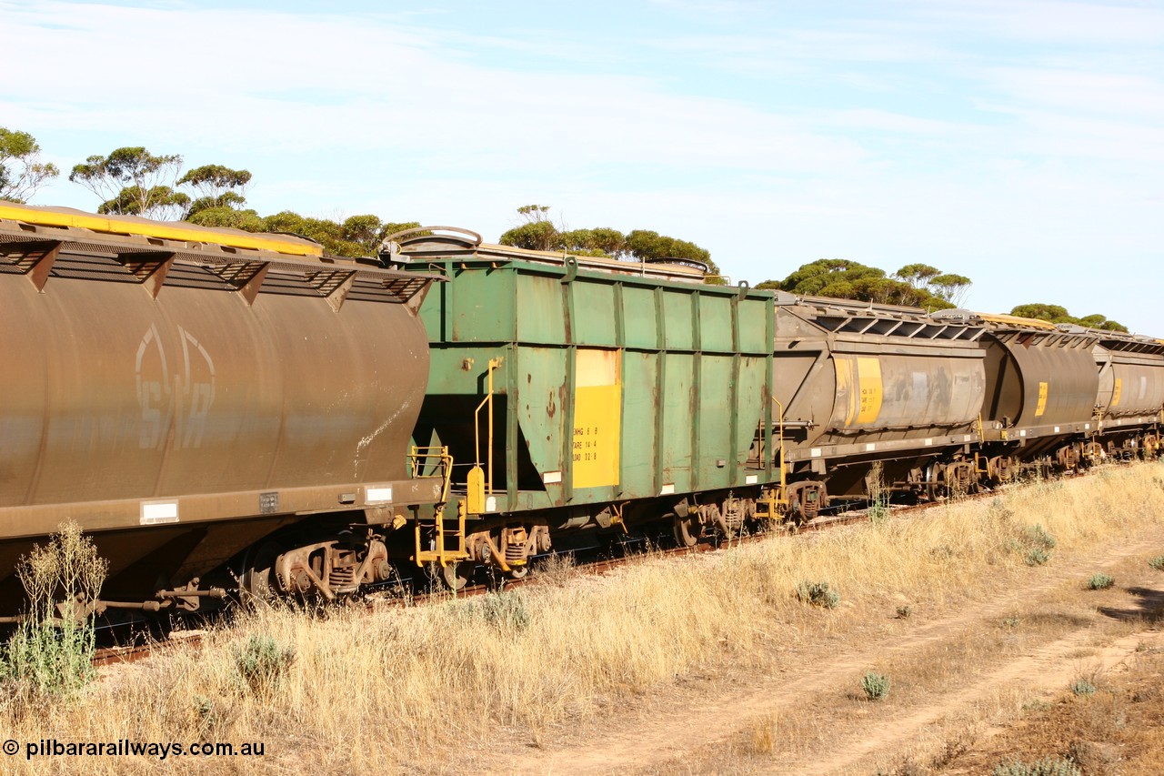 060109 2147
Wannamana, former Australian National narrow gauge ENHG type bogie grain waggon ENHG 6, originally built by Moore Road Ind, Victoria as NB type NB 1444 ballast hopper for the NAR, then to standard gauge in 1975 as BA type BA 1536, to EP July 1984, recoded to ENHT type ENHT 11 in 1985 and further rebuilt forming one half of ENHG type grain waggon in August 1986. The conversion involved splicing 2 AHTY-ENHT type waggons together at Port Lincoln workshops, roll top cover visible, part of an empty train [url=https://goo.gl/maps/43EOs]on the curve[/url]. 9th January 2006.
Keywords: ENHG-type;ENHG6;Moore-Road-Ind-Victoria;NB-type;NB1444;BA-type;BA1536;ENHT-type;ENHT11;