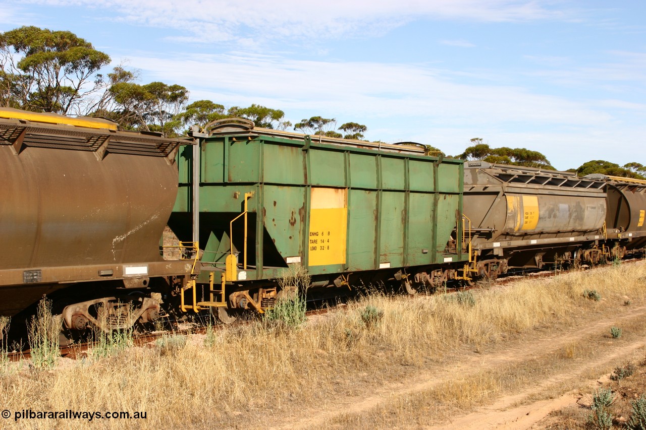 060109 2148
Wannamana, former Australian National narrow gauge ENHG type bogie grain waggon ENHG 6, originally built by Moore Road Ind, Victoria as NB type NB 1444 ballast hopper for the NAR, then to standard gauge in 1975 as BA type BA 1536, to EP July 1984, recoded to ENHT type ENHT 11 in 1985 and further rebuilt forming one half of ENHG type grain waggon in August 1986. The conversion involved splicing 2 AHTY-ENHT type waggons together at Port Lincoln workshops, with an HCN type HCN 36 behind it, part of an empty train [url=https://goo.gl/maps/43EOs]on the curve[/url]. 9th January 2006.
Keywords: ENHG-type;ENHG6;Moore-Road-Ind-Victoria;NB-type;NB1444;BA-type;BA1536;ENHT-type;ENHT11;