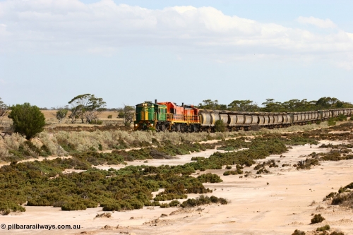 060109 2091
Kyancutta at the 198 km, ASR 830 class unit 842, an AE Goodwin built ALCo DL531 model loco serial 84140 leads EMD unit 1204 due to air-conditioning trouble and sister ALCo 851 across a dry salt soak with a north bound empty grain train. January 9, 2006.
Keywords: 830-class;842;AE-Goodwin;ALCo;DL531;84140;