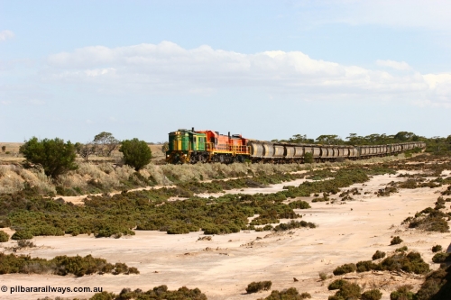 060109 2095
Kyancutta at the 198 km, ASR 830 class unit 842, an AE Goodwin built ALCo DL531 model loco serial 84140 leads EMD unit 1204 due to air-conditioning trouble and sister ALCo 851 across a dry salt soak with a north bound empty grain train. January 9, 2006.
Keywords: 830-class;842;AE-Goodwin;ALCo;DL531;84140;