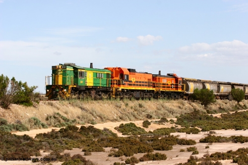 060109 2097
Kyancutta at the 198 km, ASR 830 class unit 842, an AE Goodwin built ALCo DL531 model loco serial 84140 leads EMD unit 1204 due to air-conditioning trouble and sister ALCo 851 across a dry salt soak with a north bound empty grain train. January 9, 2006.
Keywords: 830-class;842;AE-Goodwin;ALCo;DL531;84140;