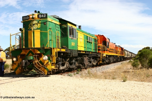 060109 2103
Kyancutta, Kyancutta Tanks Rd grade crossing, ASR 830 class unit 842, an AE Goodwin built ALCo DL531 model loco serial 84140 leads EMD unit 1204 due to air-conditioning trouble and sister ALCo 851 as the empty north bound grain train pauses for a crew change. January 9, 2006.
Keywords: 830-class;842;AE-Goodwin;ALCo;DL531;84140;