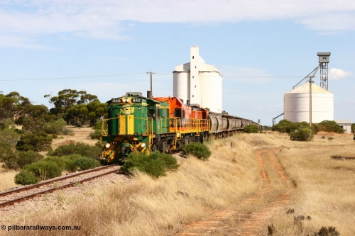 060109 2113
Kyancutta, ASR 830 class unit 842, an AE Goodwin built ALCo DL531 model loco serial 84140 leads EMD unit 1204 due to air-conditioning trouble and sister ALCo 851 as they shunt across Museum Terrace to place empty grain waggons on the silo loop. January 9, 2006.
Keywords: 830-class;842;AE-Goodwin;ALCo;DL531;84140;