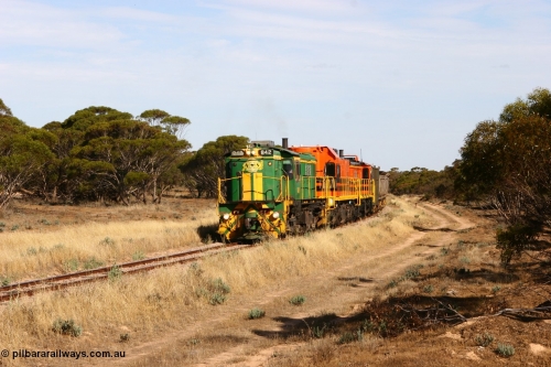 060109 2138
Wannamana, [url=https://goo.gl/maps/43EOs]on the curve[/url] 2 km north of the former station site empty train lead by ASR 830 class unit 842, an AE Goodwin built ALCo DL531 model loco serial 84140 with an EMD 1200 class and a sister ALCo unit. January 9, 2006.
Keywords: 830-class;842;AE-Goodwin;ALCo;DL531;84140;