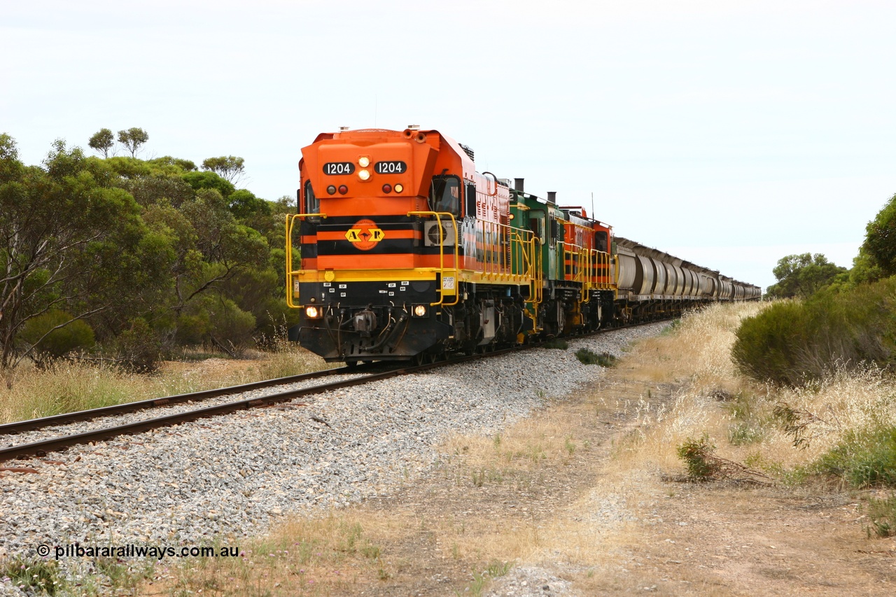 060110 2151
Pillana, former station site, 59 km, empty grain train behind ARG 1200 class unit 1204, a Clyde Engineering EMD model G12C serial 65-428, originally built for the WAGR as the final unit of fourteen A class locomotives in 1965 then sent to the Eyre Peninsula in July 2004, and two 830 class AE Goodwin built ALCo model DL531 units 842 serial 84140 ex SAR broad gauge to Eyre Peninsula in October 1987, and 851 serial 84137 new to Eyre Peninsula in 1962. [url=https://goo.gl/maps/BcnmpGwGqtw]Approx. location of photo[/url].
Keywords: 1200-class;1204;Clyde-Engineering-Granville-NSW;EMD;G12C;65-428;A-class;A1514;830-class;842;851;AE-Goodwin;ALCo;DL531;84137;84140;