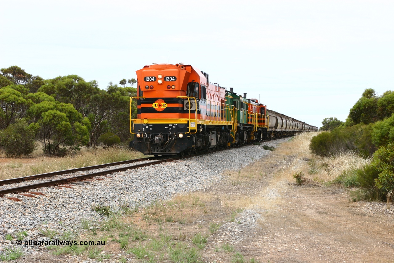 060110 2152
Pillana, former station site, 59 km, empty grain train behind ARG 1200 class unit 1204, a Clyde Engineering EMD model G12C serial 65-428, originally built for the WAGR as the final unit of fourteen A class locomotives in 1965 then sent to the Eyre Peninsula in July 2004, and two 830 class AE Goodwin built ALCo model DL531 units 842 serial 84140 ex SAR broad gauge to Eyre Peninsula in October 1987, and 851 serial 84137 new to Eyre Peninsula in 1962. [url=https://goo.gl/maps/BcnmpGwGqtw]Approx. location of photo[/url].
Keywords: 1200-class;1204;Clyde-Engineering-Granville-NSW;EMD;G12C;65-428;A-class;A1514;830-class;842;851;AE-Goodwin;ALCo;DL531;84137;84140;