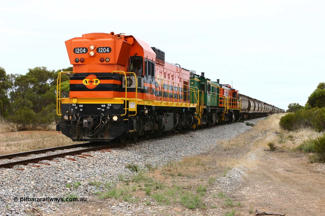 060110 2153
Pillana, former station site, 59 km, empty grain train behind ARG 1200 class unit 1204, a Clyde Engineering EMD model G12C serial 65-428, originally built for the WAGR as the final unit of fourteen A class locomotives in 1965 then sent to the Eyre Peninsula in July 2004, and two 830 class AE Goodwin built ALCo model DL531 units 842 serial 84140 ex SAR broad gauge to Eyre Peninsula in October 1987, and 851 serial 84137 new to Eyre Peninsula in 1962. [url=https://goo.gl/maps/BcnmpGwGqtw]Approx. location of photo[/url].
Keywords: 1200-class;1204;Clyde-Engineering-Granville-NSW;EMD;G12C;65-428;A-class;A1514;830-class;842;851;AE-Goodwin;ALCo;DL531;84137;84140;