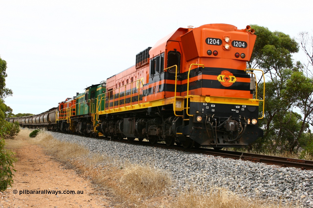 060110 2160
Near the 64 km between Pillana and Cummins, empty grain train behind ARG 1200 class unit 1204, a Clyde Engineering EMD model G12C serial 65-428, originally built for the WAGR as the final unit of fourteen A class locomotives in 1965 then sent to the Eyre Peninsula in July 2004, and two 830 class AE Goodwin built ALCo model DL531 units 842 serial 84140 ex SAR broad gauge to Eyre Peninsula in October 1987, and 851 serial 84137 new to Eyre Peninsula in 1962. [url=https://goo.gl/maps/NECDZnDkLfv]Approx. location of photo[/url].
Keywords: 1200-class;1204;Clyde-Engineering-Granville-NSW;EMD;G12C;65-428;A-class;A1514;830-class;842;851;AE-Goodwin;ALCo;DL531;84137;84140;