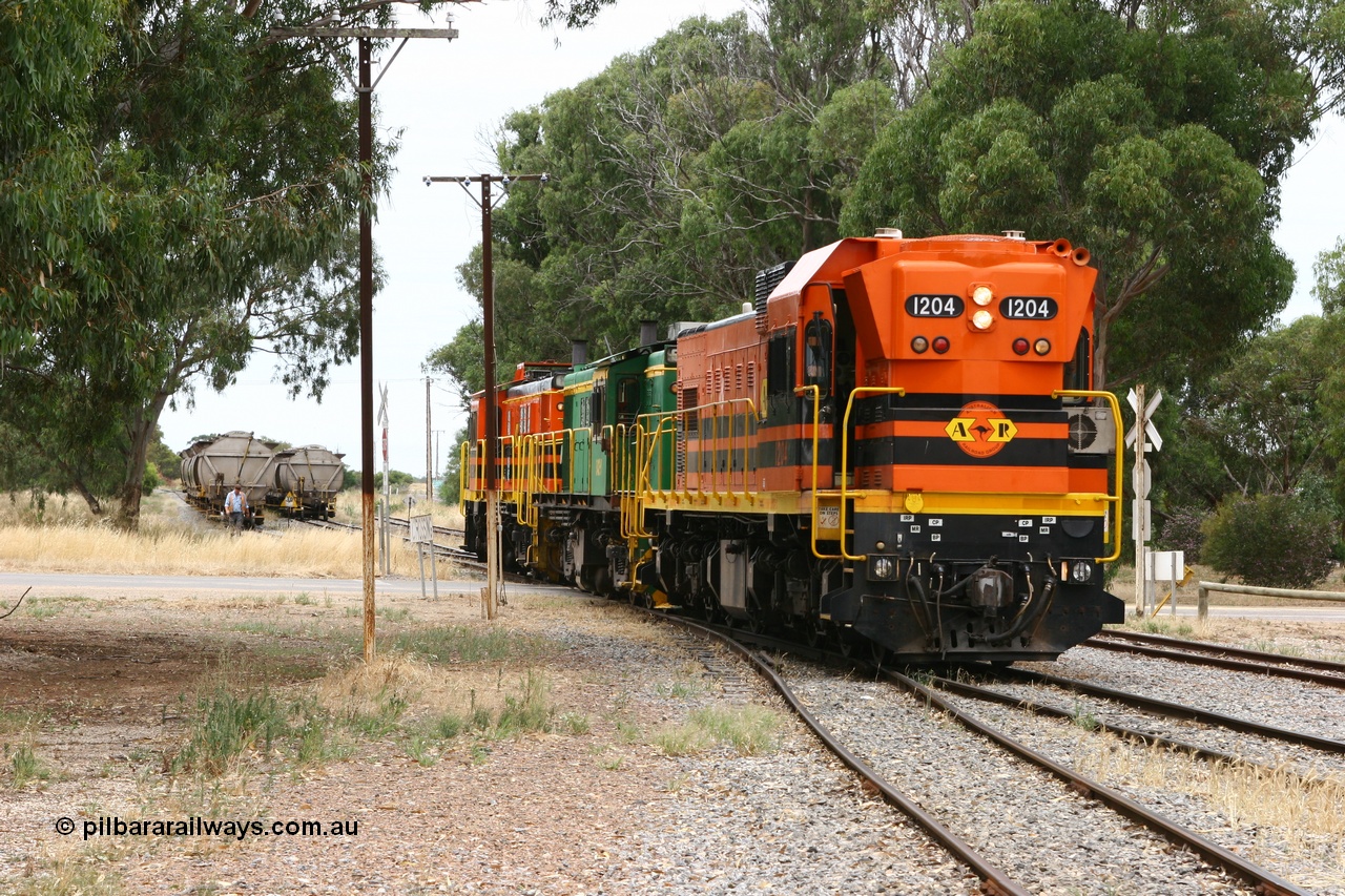 060110 2164
Cummins, view across Railway Terrace of empty grain train shunting the Cummins Bunker track to pick up empty hoppers, behind ARG 1200 class unit 1204, a Clyde Engineering EMD model G12C serial 65-428, originally built for the WAGR as the final unit of fourteen A class locomotives in 1965 and sent to the Eyre Peninsula in July 2004 and two 830 class AE Goodwin built ALCo model DL531 units 842 serial 84140 ex SAR broad gauge to Eyre Peninsula in October 1987, and 851 serial 84137 new to Eyre Peninsula in 1962. [url=https://goo.gl/maps/q5aVqSmjCP62]Approx. location of image[/url].
Keywords: 1200-class;1204;Clyde-Engineering-Granville-NSW;EMD;G12C;65-428;A-class;A1514;830-class;842;851;AE-Goodwin;ALCo;DL531;84137;84140;