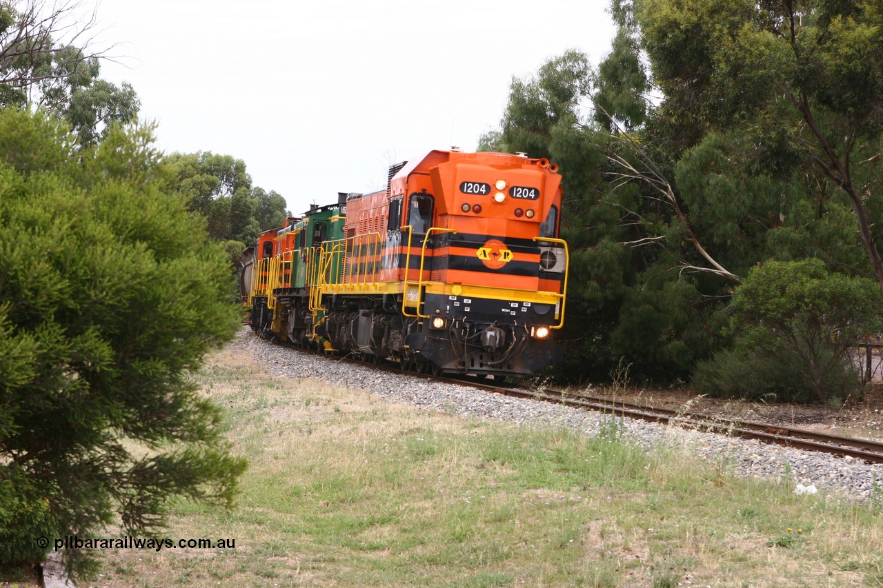 060110 2171
Cummins, empty grain train departing yard on the Penong mainline behind ARG 1200 class unit 1204, a Clyde Engineering EMD model G12C serial 65-428, originally built for the WAGR as the final unit of fourteen A class locomotives in 1965 and sent to the Eyre Peninsula in July 2004 and two 830 class AE Goodwin built ALCo model DL531 units 842 serial 84140 ex SAR broad gauge to Eyre Peninsula in October 1987, and 851 serial 84137 new to Eyre Peninsula in 1962. [url=https://goo.gl/maps/cL7ZN9y12t92]Approx. location of image[/url].
Keywords: 1200-class;1204;Clyde-Engineering-Granville-NSW;EMD;G12C;65-428;A-class;A1514;830-class;842;851;AE-Goodwin;ALCo;DL531;84137;84140;