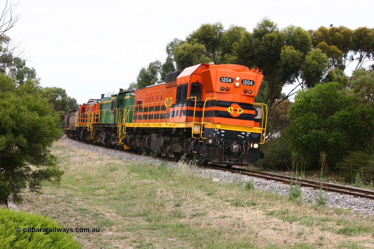 060110 2172
Cummins, empty grain train departing yard on the Penong mainline behind ARG 1200 class unit 1204, a Clyde Engineering EMD model G12C serial 65-428, originally built for the WAGR as the final unit of fourteen A class locomotives in 1965 and sent to the Eyre Peninsula in July 2004 and two 830 class AE Goodwin built ALCo model DL531 units 842 serial 84140 ex SAR broad gauge to Eyre Peninsula in October 1987, and 851 serial 84137 new to Eyre Peninsula in 1962. [url=https://goo.gl/maps/cL7ZN9y12t92]Approx. location of image[/url].
Keywords: 1200-class;1204;Clyde-Engineering-Granville-NSW;EMD;G12C;65-428;A-class;A1514;830-class;842;851;AE-Goodwin;ALCo;DL531;84137;84140;