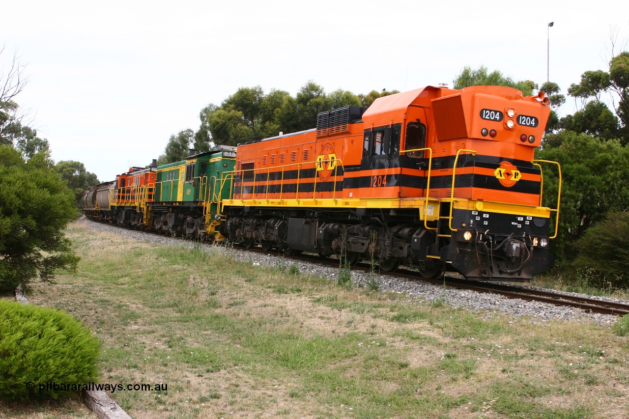 060110 2173
Cummins, empty grain train departing yard on the Penong mainline behind ARG 1200 class unit 1204, a Clyde Engineering EMD model G12C serial 65-428, originally built for the WAGR as the final unit of fourteen A class locomotives in 1965 and sent to the Eyre Peninsula in July 2004 and two 830 class AE Goodwin built ALCo model DL531 units 842 serial 84140 ex SAR broad gauge to Eyre Peninsula in October 1987, and 851 serial 84137 new to Eyre Peninsula in 1962. [url=https://goo.gl/maps/cL7ZN9y12t92]Approx. location of image[/url].
Keywords: 1200-class;1204;Clyde-Engineering-Granville-NSW;EMD;G12C;65-428;A-class;A1514;830-class;842;851;AE-Goodwin;ALCo;DL531;84137;84140;