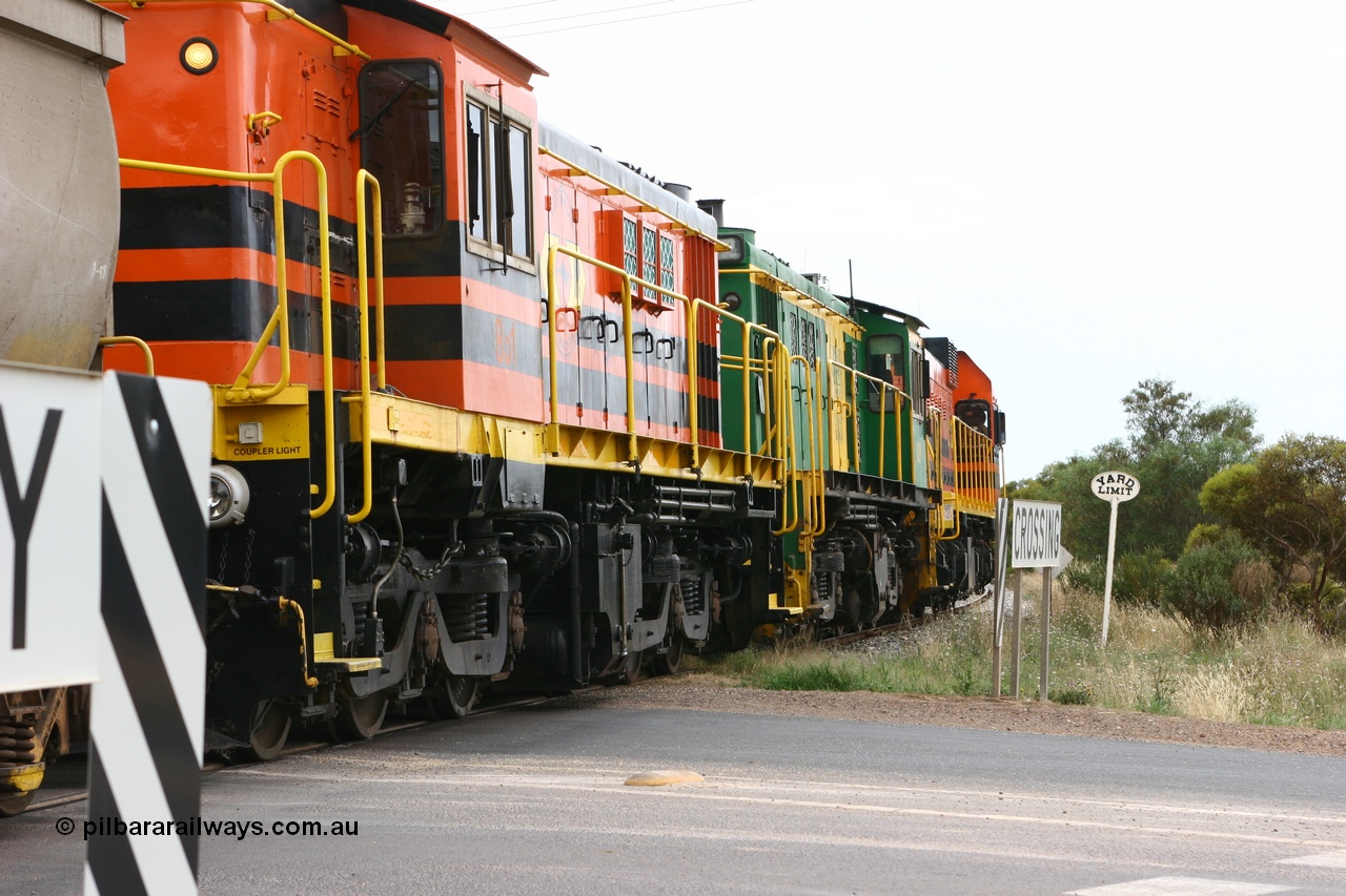 060110 2174
Cummins, empty grain train departing yard on the Penong mainline at the Bratten Way grade crossing behind ARG 1200 class unit 1204, a Clyde Engineering EMD model G12C serial 65-428, originally built for the WAGR as the final unit of fourteen A class locomotives in 1965 and sent to the Eyre Peninsula in July 2004 and two 830 class AE Goodwin built ALCo model DL531 units 842 serial 84140 ex SAR broad gauge to Eyre Peninsula in October 1987, and 851 serial 84137 new to Eyre Peninsula in 1962. [url=https://goo.gl/maps/cL7ZN9y12t92]Approx. location of image[/url].
Keywords: 1200-class;1204;Clyde-Engineering-Granville-NSW;EMD;G12C;65-428;A-class;A1514;830-class;842;851;AE-Goodwin;ALCo;DL531;84137;84140;