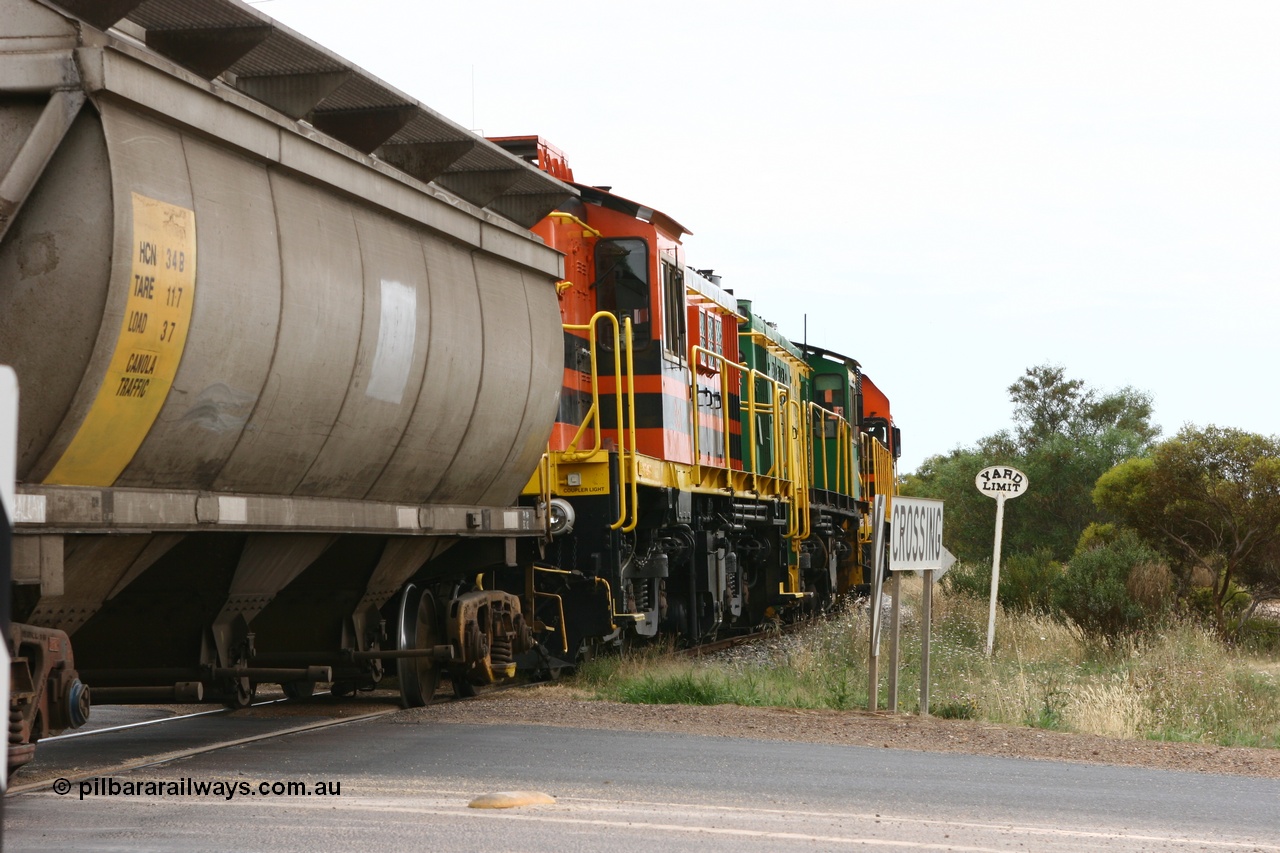 060110 2175
Cummins, empty grain train departing yard on the Penong mainline at the Bratten Way grade crossing behind ARG 1200 class unit 1204, a Clyde Engineering EMD model G12C serial 65-428, originally built for the WAGR as the final unit of fourteen A class locomotives in 1965 and sent to the Eyre Peninsula in July 2004 and two 830 class AE Goodwin built ALCo model DL531 units 842 serial 84140 ex SAR broad gauge to Eyre Peninsula in October 1987, and 851 serial 84137 new to Eyre Peninsula in 1962. [url=https://goo.gl/maps/cL7ZN9y12t92]Approx. location of image[/url].
Keywords: 1200-class;1204;Clyde-Engineering-Granville-NSW;EMD;G12C;65-428;A-class;A1514;830-class;842;851;AE-Goodwin;ALCo;DL531;84137;84140;